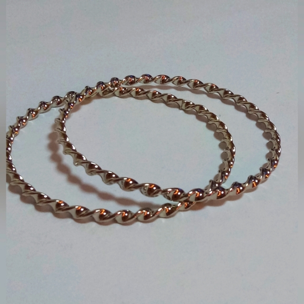 Silver twirled hoop bracelets